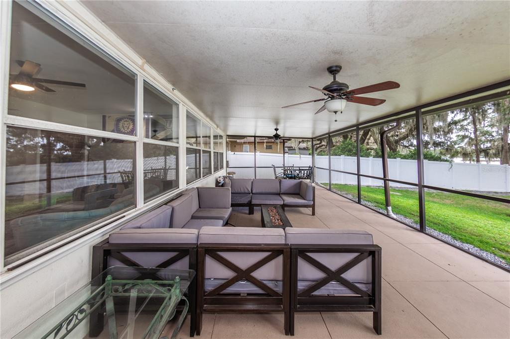 5584 North Dean Road Orlando, FL 32817 - Photo 28 of 39 a view of a patio with a table and chairs