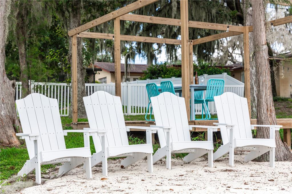 5584 North Dean Road Orlando, FL 32817 - Photo 32 of 39 a view of a chairs with a wooden deck