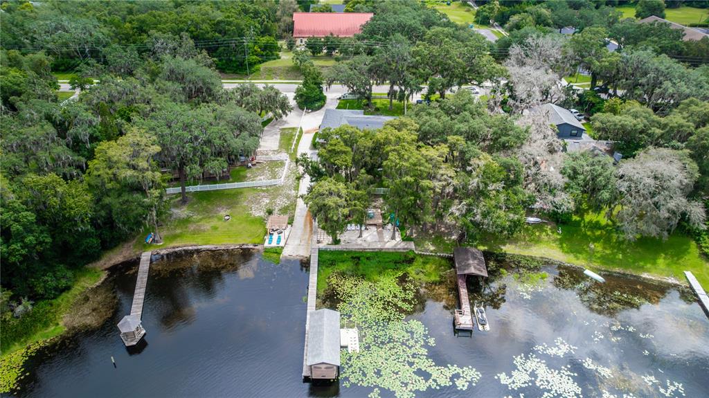5584 North Dean Road Orlando, FL 32817 - Photo 34 of 39 a view of a lake with a yard