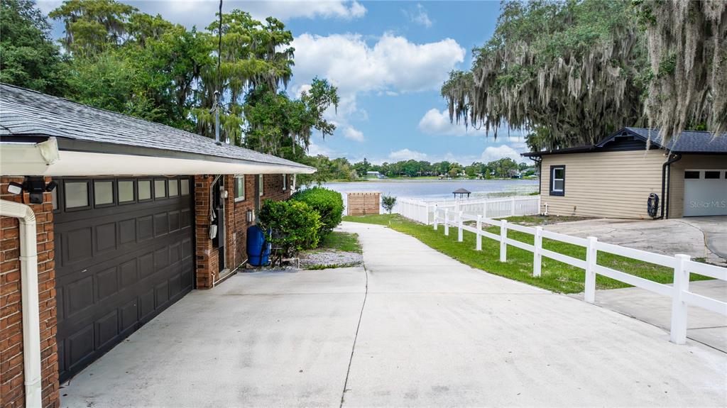 5584 North Dean Road Orlando, FL 32817 - Photo 35 of 39 a view of a house with a yard and potted plants