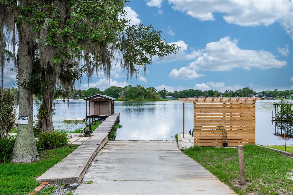5584 North Dean Road Orlando, FL 32817 - Photo 36 of 39 a front view of a house with a lake view