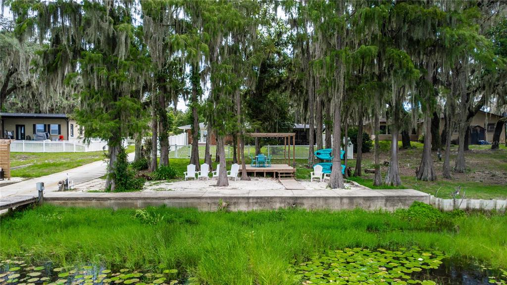 5584 North Dean Road Orlando, FL 32817 - Photo 38 of 39 a view of a house with backyard and sitting area