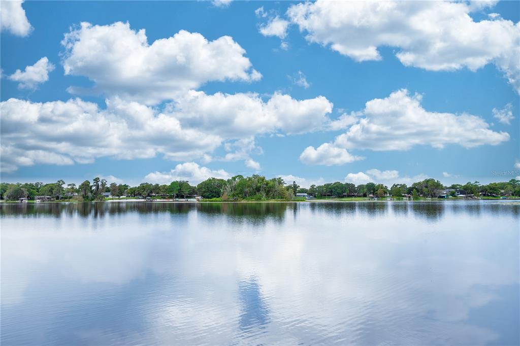 5584 North Dean Road Orlando, FL 32817 - Photo 39 of 39 a view of a lake with houses in the back
