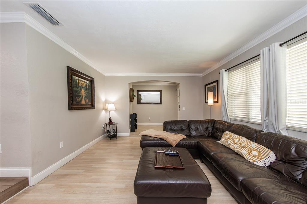 5584 North Dean Road Orlando, FL 32817 - Photo 8 of 39 a living room with furniture and a window