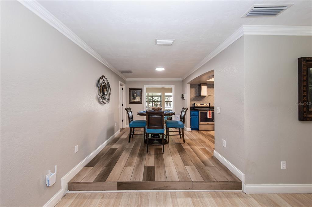 5584 North Dean Road Orlando, FL 32817 - Photo 9 of 39 a living room with furniture and wooden floor