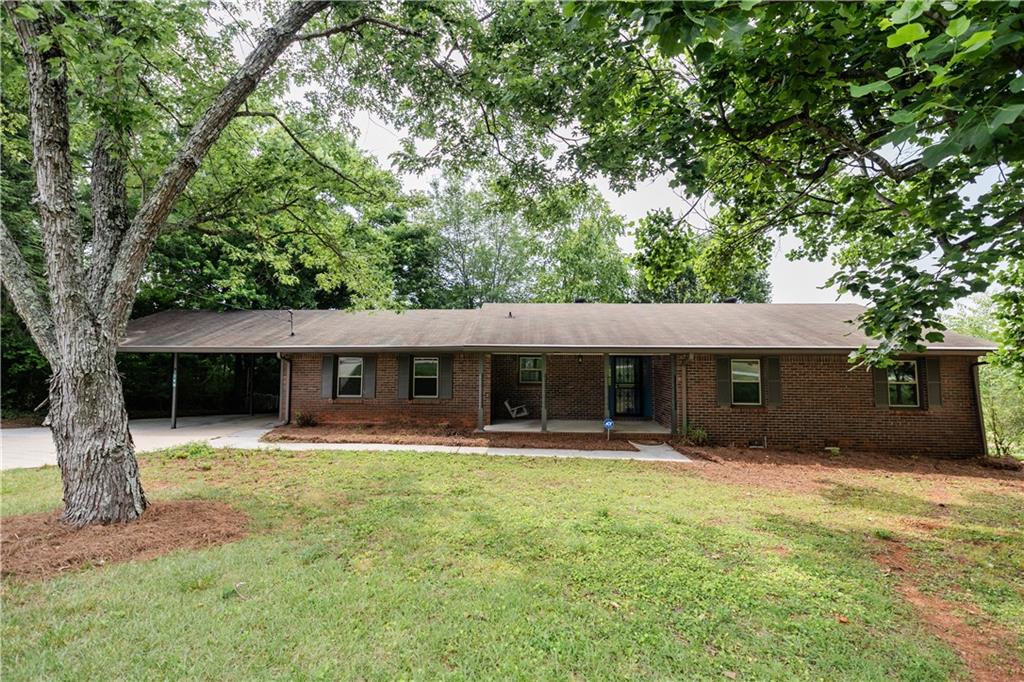 150 Cochran Ridge Road Dallas, GA 30157 - Photo 1 of 1 a front view of a house with a yard and trees