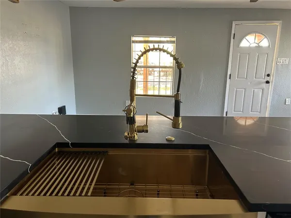 a close view of kitchen countertops with fireplace