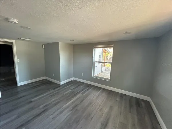 a bathroom with a shower a toilet and a sink
