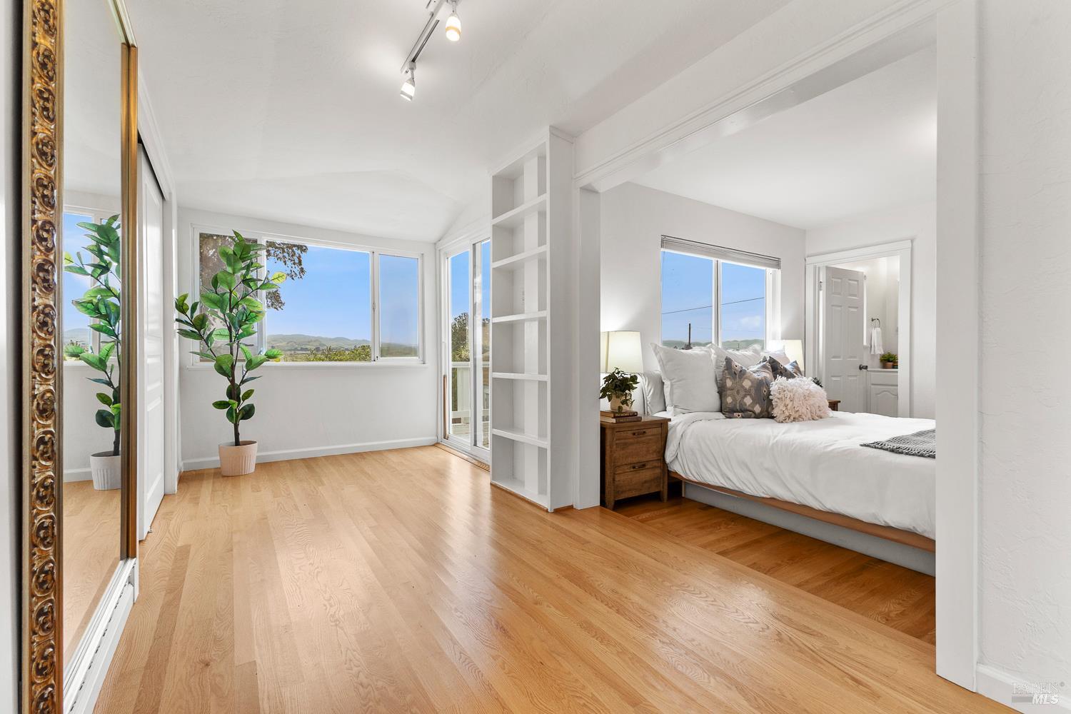 1636 Milton Road Napa, CA 94559 - Photo 10 of 66 Primary bedroom with spacious sitting room. The adjacent deck opens to a view of wetlands.