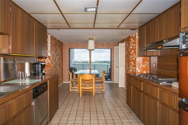 a very nice looking kitchen with a large window