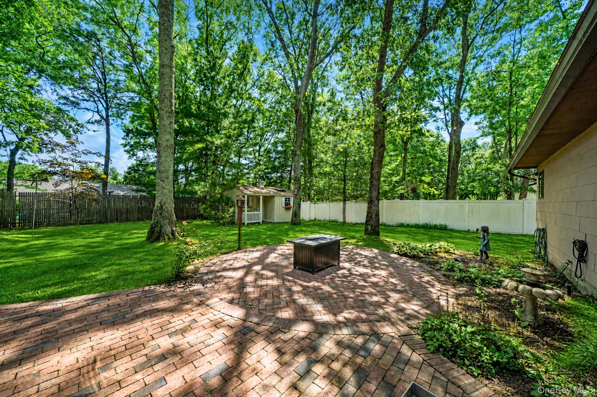 96 Fulton Boulevard Commack, NY 11725 - Photo 6 of 41 a view of a park with large trees