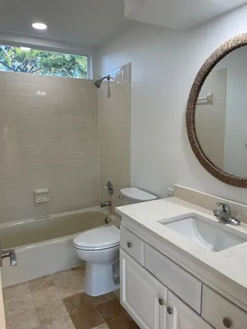 a view of backyard with swimming pool and green space