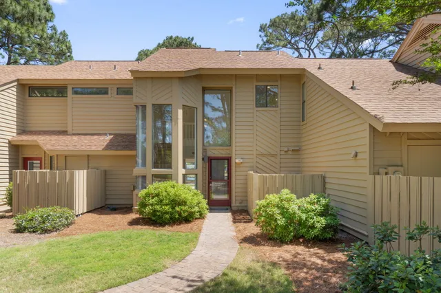 a view of a kitchen with a sink and a window
