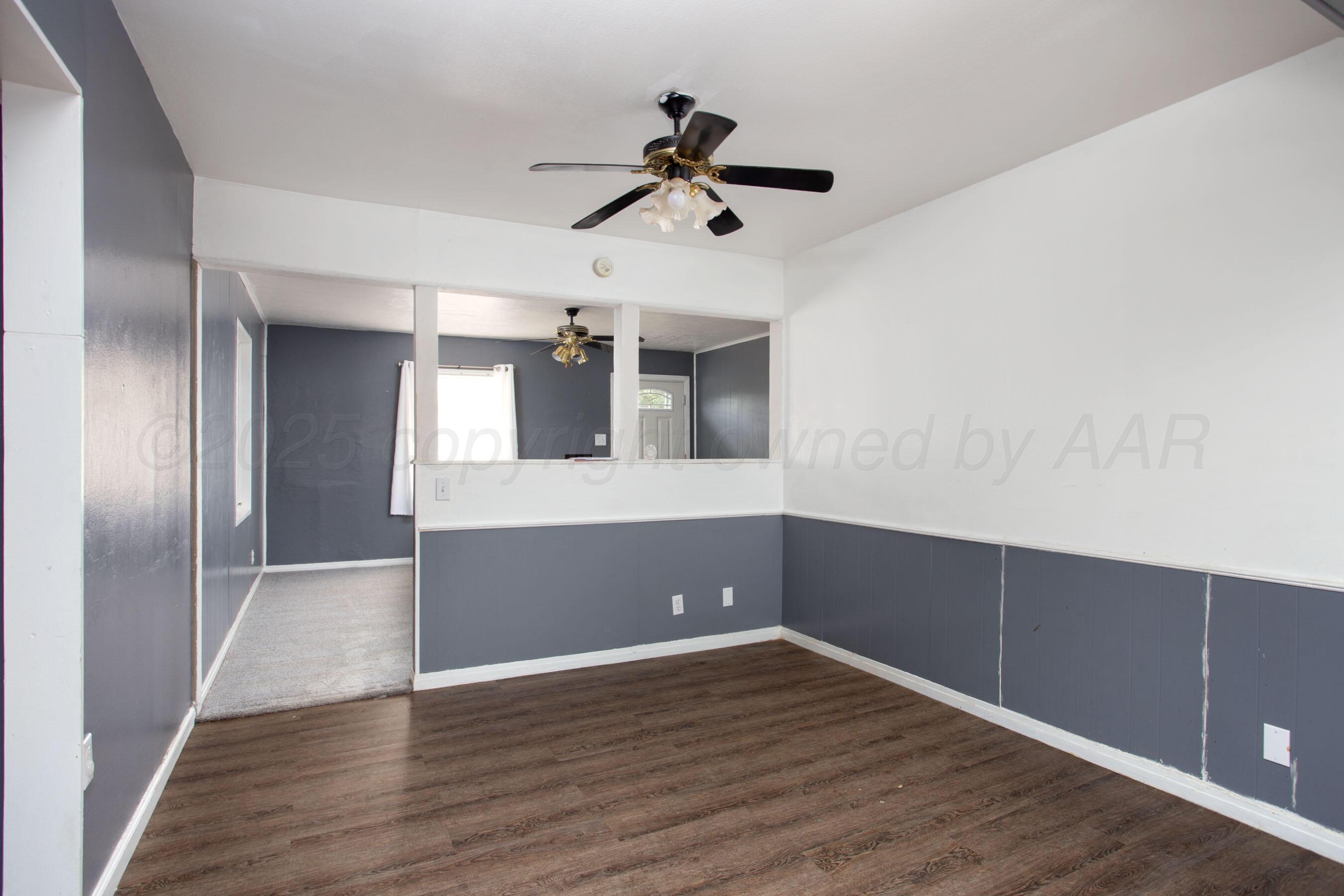 4630 South Hayden Street Amarillo, TX 79110 - Photo 13 of 26 a view of empty room and wooden floor