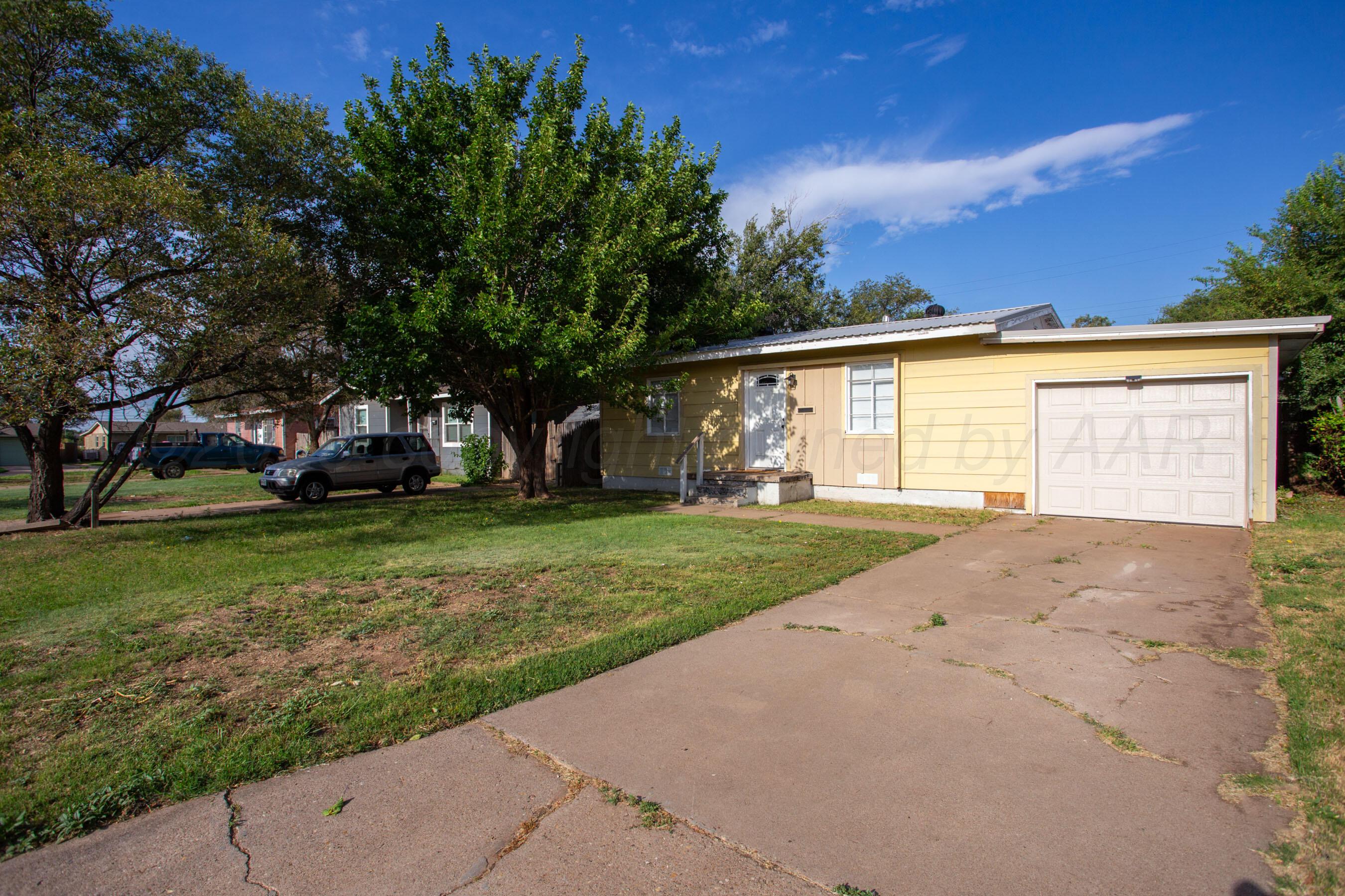 4630 South Hayden Street Amarillo, TX 79110 - Photo 2 of 26 front view of house with a yard