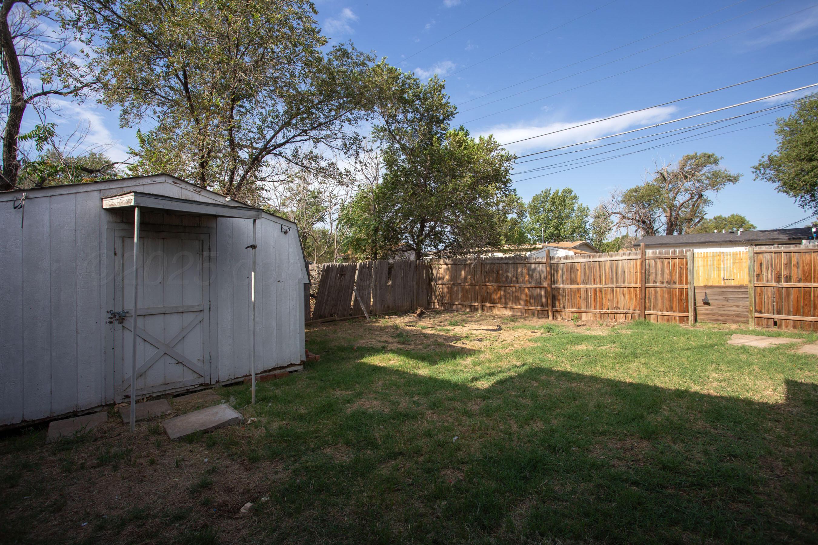 4630 South Hayden Street Amarillo, TX 79110 - Photo 22 of 26 a view of a backyard with large trees