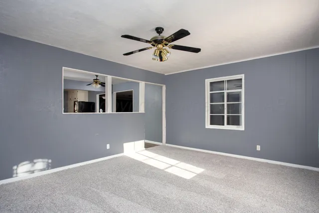 a view of a ceiling fan with a window