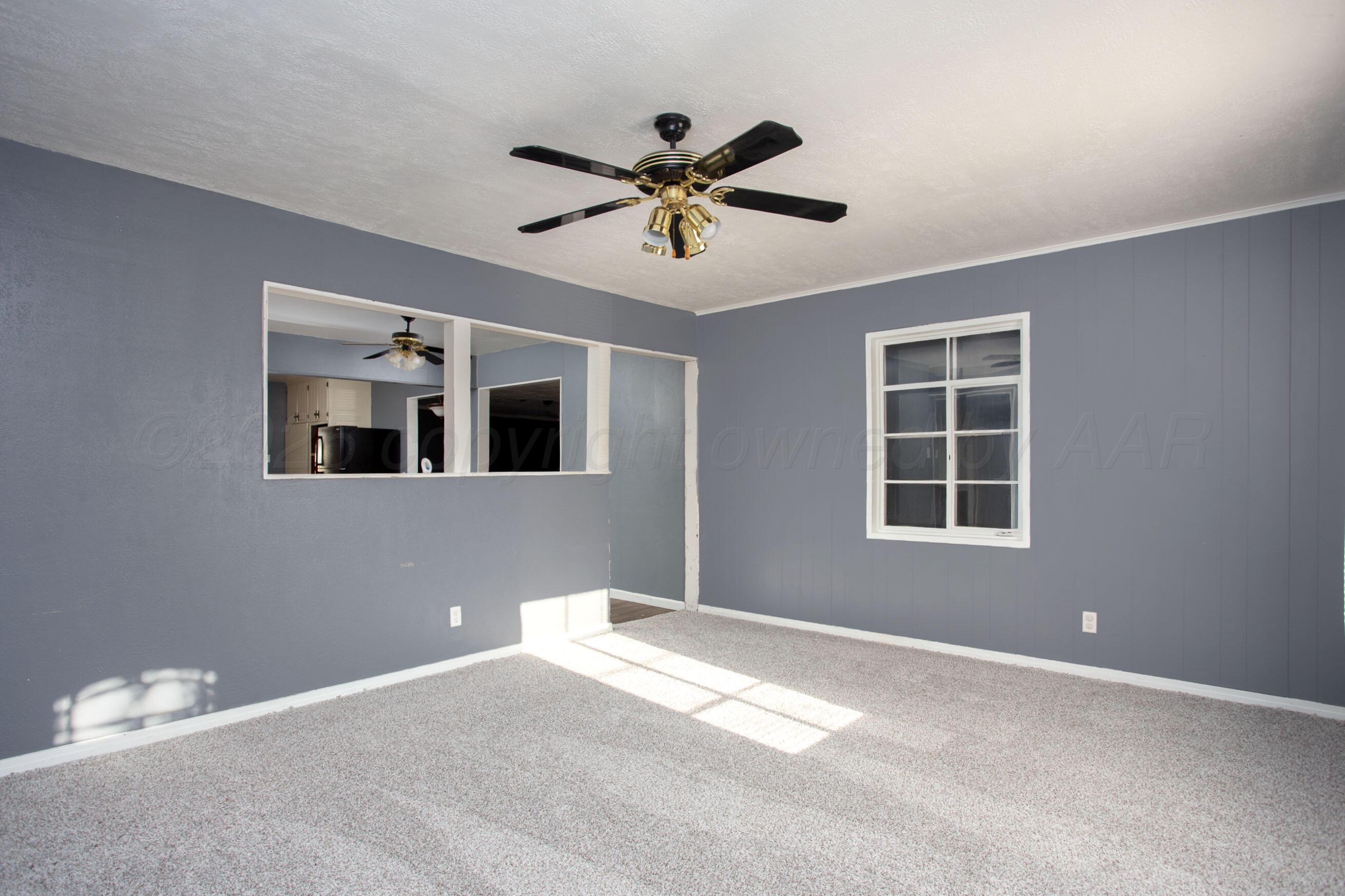 4630 South Hayden Street Amarillo, TX 79110 - Photo 9 of 26 a view of a ceiling fan with a window