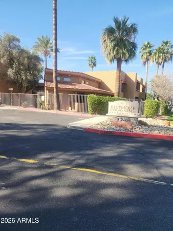 a front view of a house with a ocean beach