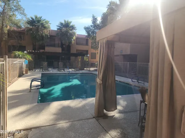 a view of a patio with table and chairs and potted plants