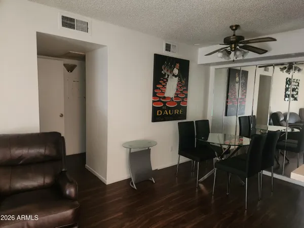 a view of a livingroom with furniture and wooden floor