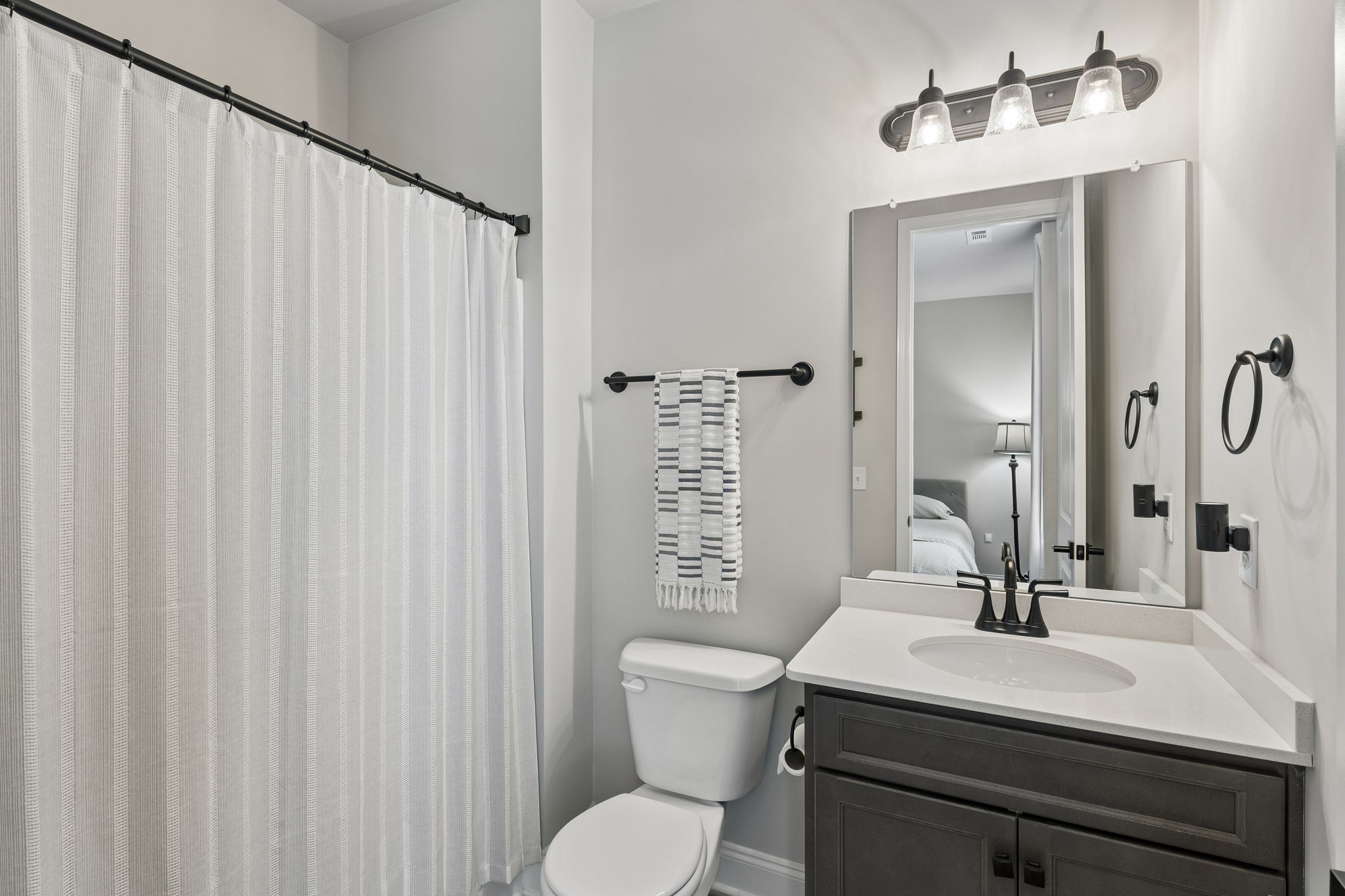 4004 John Marsh Rd Spring Hill Spring Hill, TN 37174 - Photo 15 of 21 a bathroom with a sink a toilet and mirror