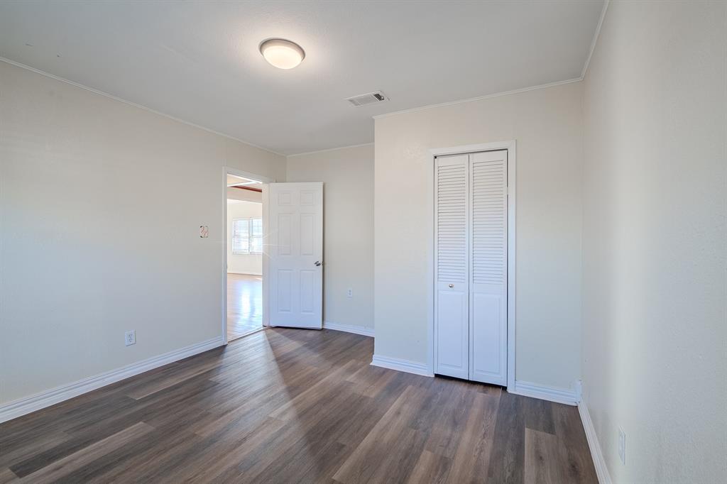 1107 Ferndale Avenue Dallas, TX 75224 - Photo 17 of 20 a view of an empty room with wooden floor