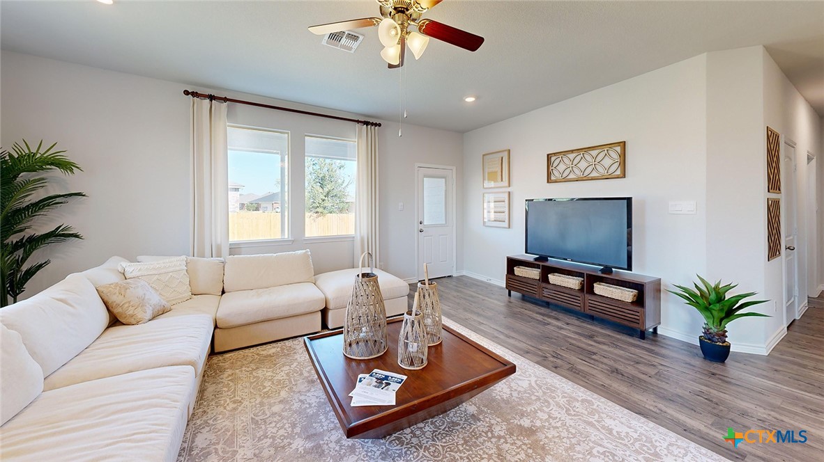 14096 Carsten Loop Salado, TX 76571 - Photo 12 of 32 a living room with furniture a window and a flat screen tv