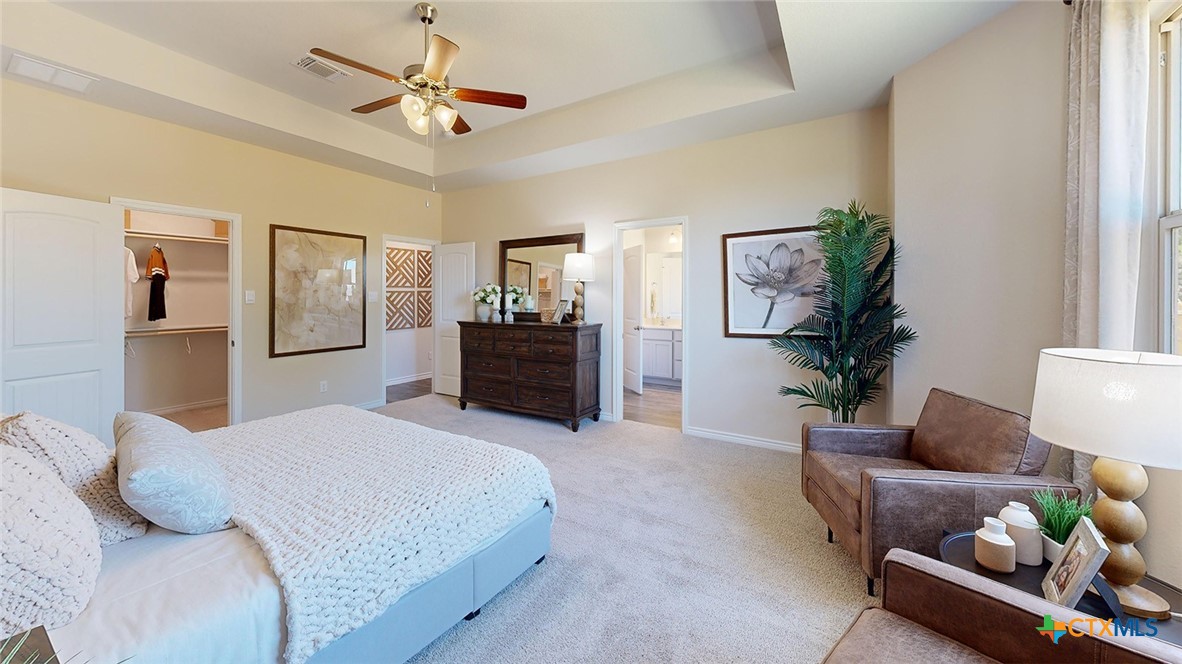 14096 Carsten Loop Salado, TX 76571 - Photo 16 of 32 a bedroom with a large bed and furniture