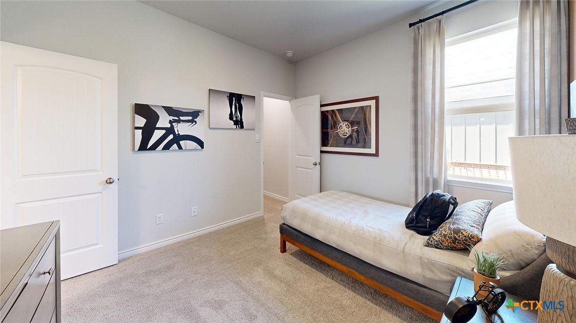 14096 Carsten Loop Salado, TX 76571 - Photo 23 of 32 a bedroom with a bed and a window
