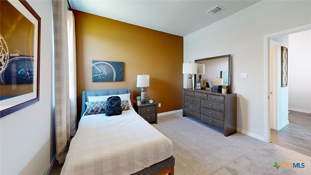 14096 Carsten Loop Salado, TX 76571 - Photo 24 of 32 a bedroom with a bed and lamp