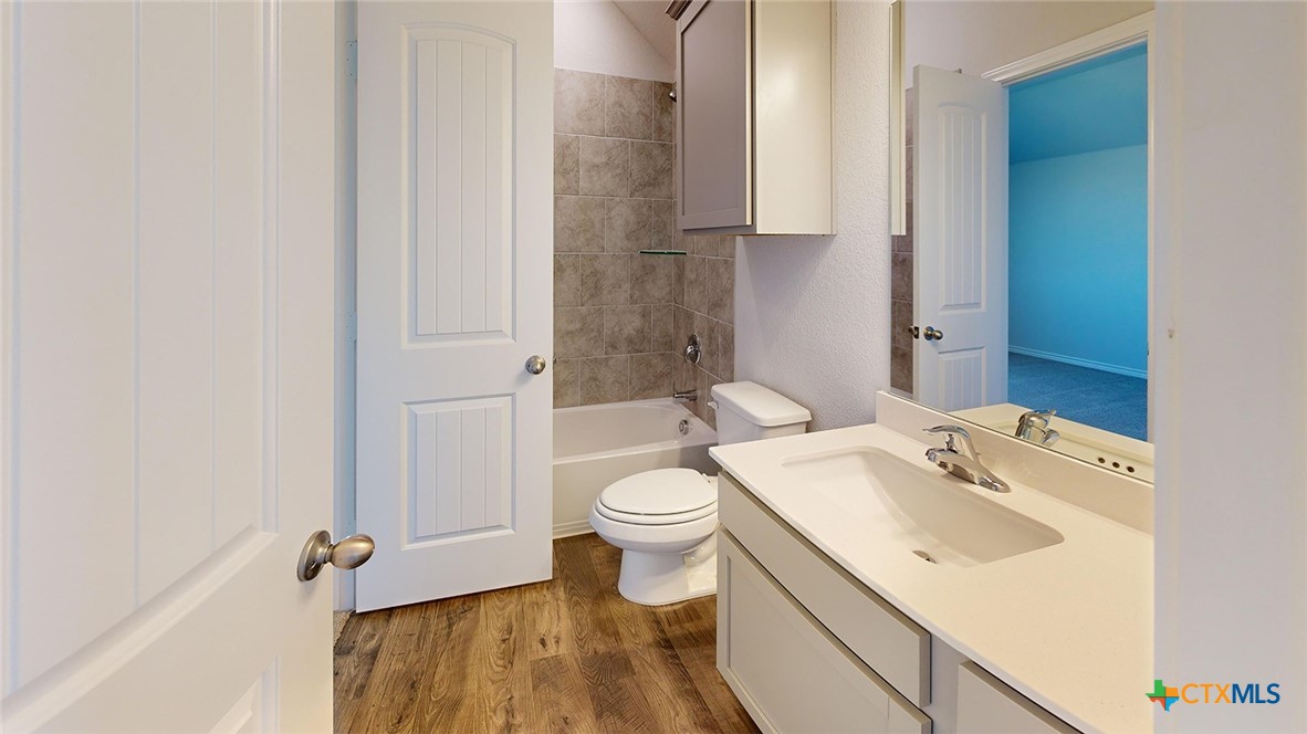 14096 Carsten Loop Salado, TX 76571 - Photo 29 of 32 a bathroom with a sink toilet and shower
