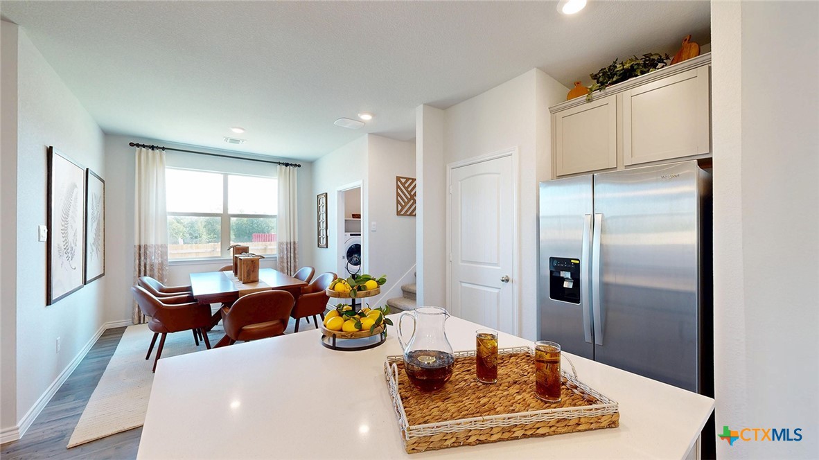 14096 Carsten Loop Salado, TX 76571 - Photo 8 of 32 a kitchen with sink and refrigerator