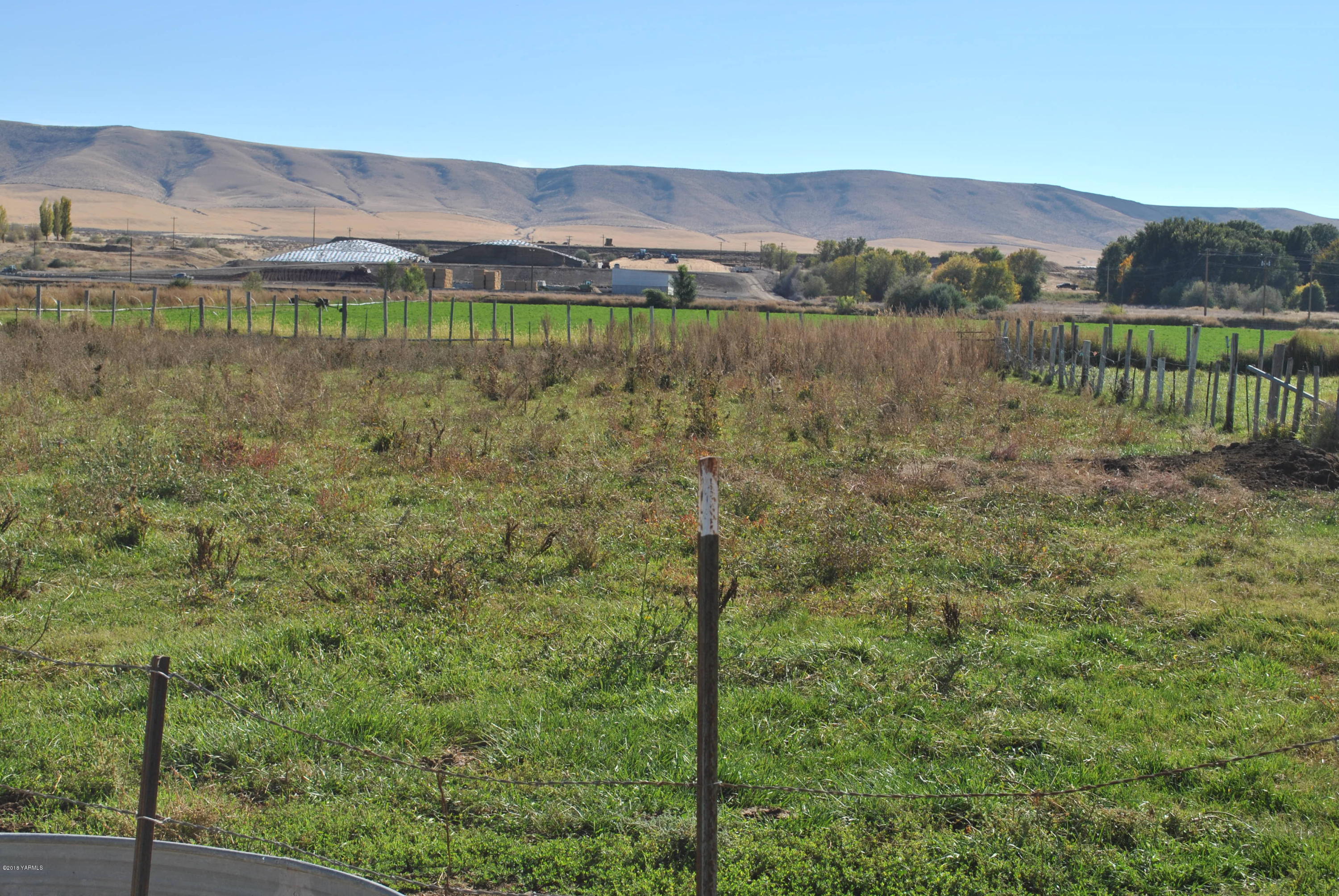 Sr-22 Bus Road Mabton, WA 98935 - Photo 5 of 15 a view of a lake with a mountain in the background