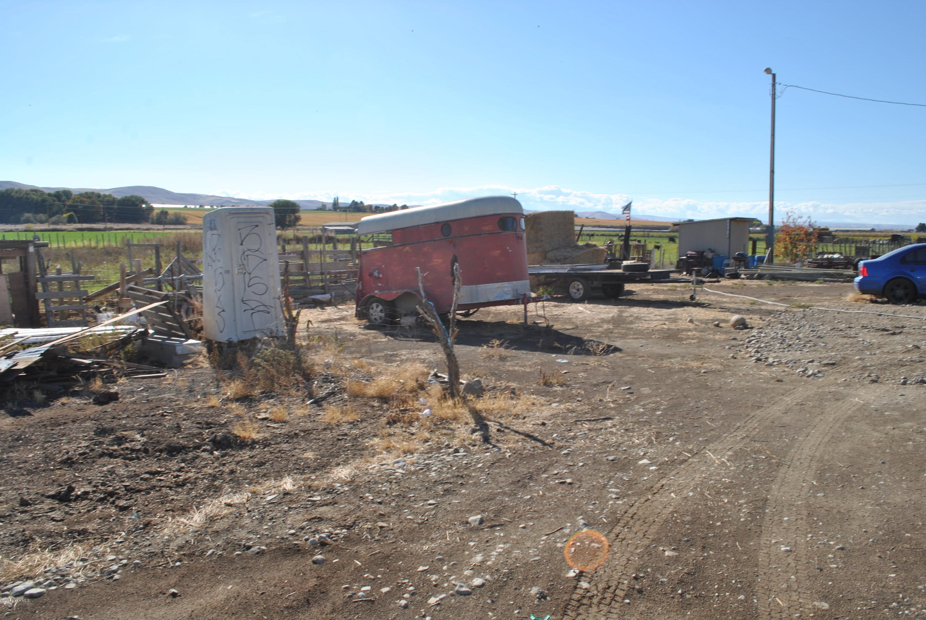 Sr-22 Bus Road Mabton, WA 98935 - Photo 10 of 15 a view of a dry yard with wooden fence