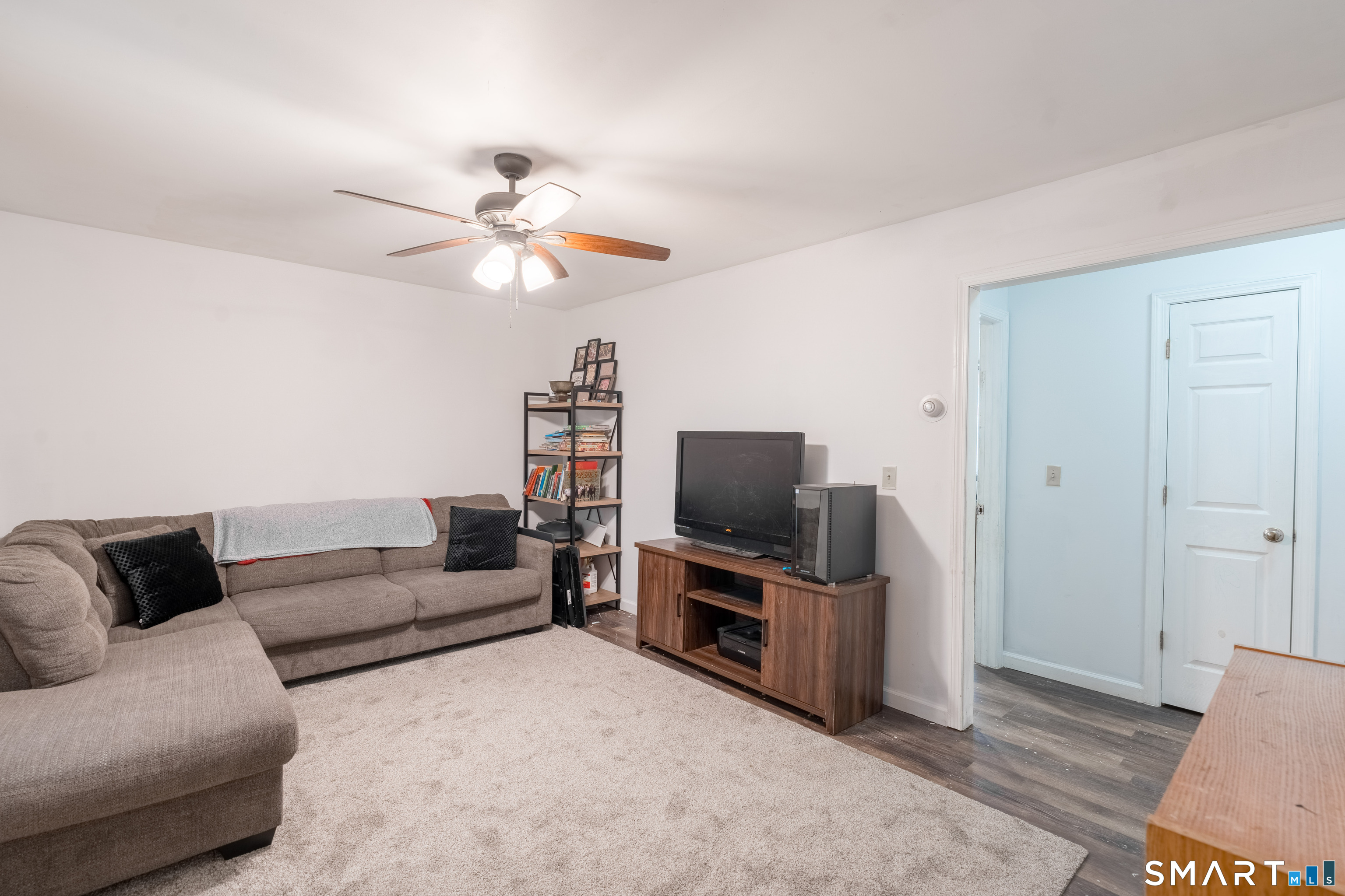 379 Christian Hill Road Brooklyn, CT 06234 - Photo 19 of 40 a living room with furniture and a flat screen tv