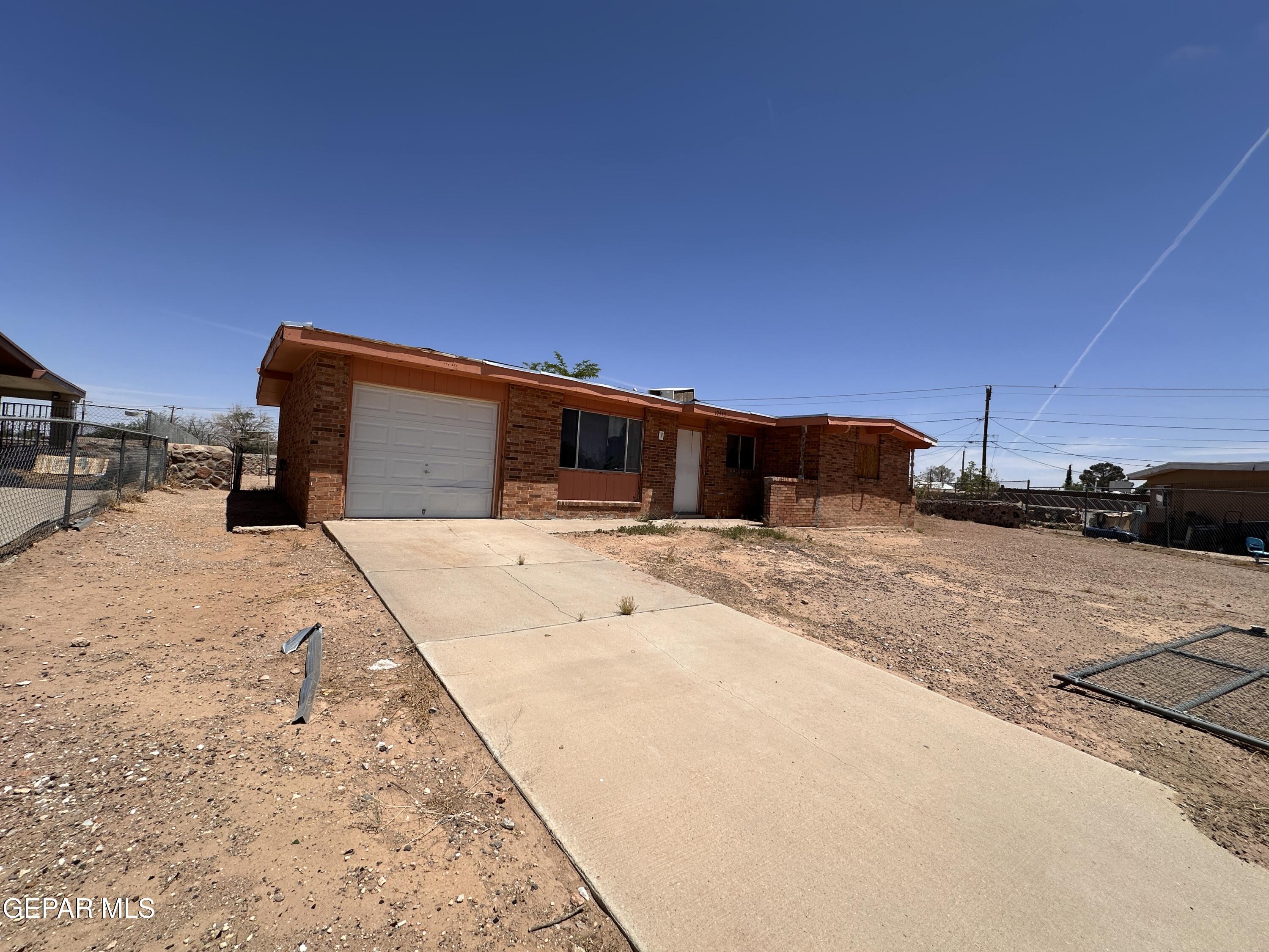a view of a backyard of the house