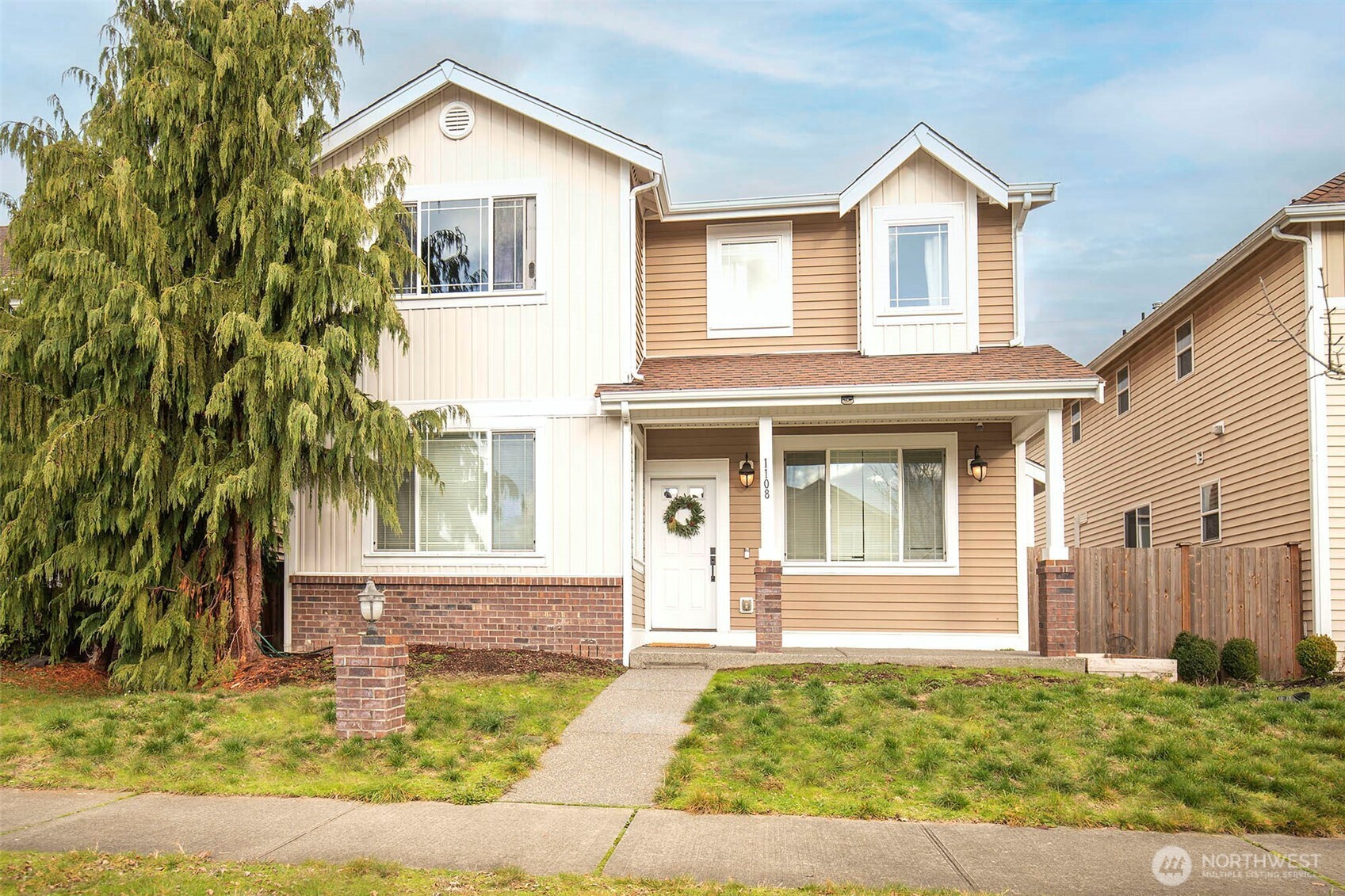 front view of a house with a yard