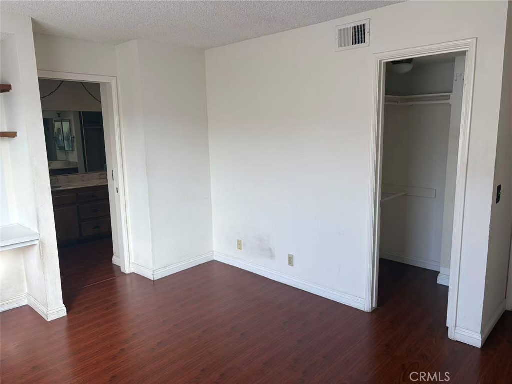 116 East Commonwealth Avenue Alhambra, CA 91801 - Photo 9 of 15 an empty room with wooden floor and closet