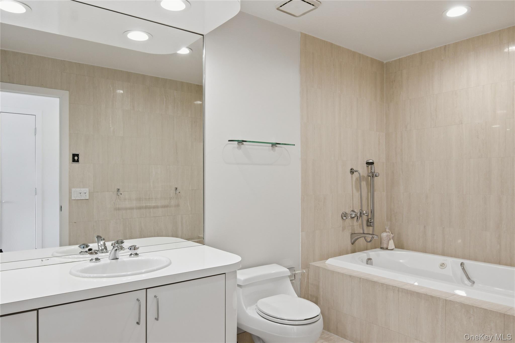 23 Library Avenue, Unit 1 Westhampton Beach, NY 11978 - Photo 17 of 24 Full bathroom with vanity and recessed lighting