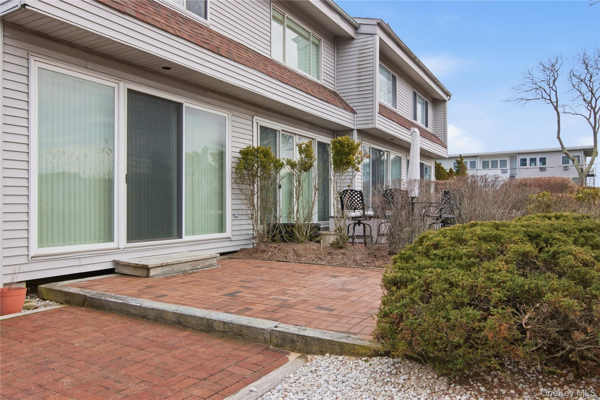 23 Library Avenue, Unit 1 Westhampton Beach, NY 11978 - Photo 18 of 24 Double patio for end unit