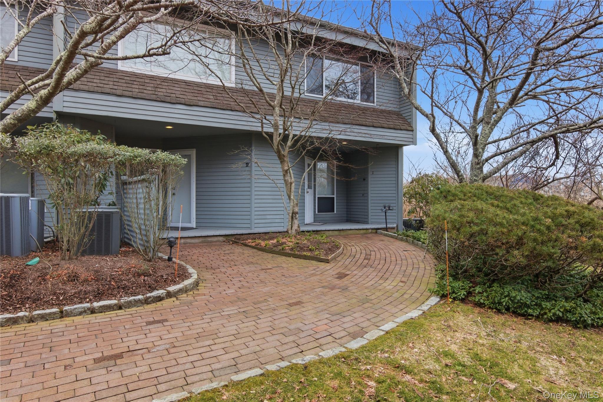 23 Library Avenue, Unit 1 Westhampton Beach, NY 11978 - Photo 2 of 24 Front of unit, corner end unit