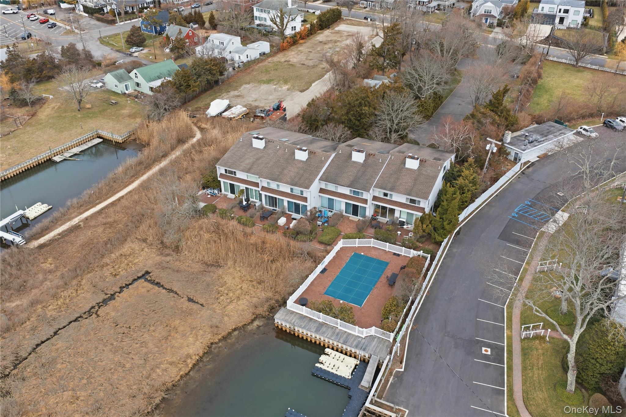 23 Library Avenue, Unit 1 Westhampton Beach, NY 11978 - Photo 21 of 24 Aerial overview of property's location with a nearby body of water and nearby suburban area