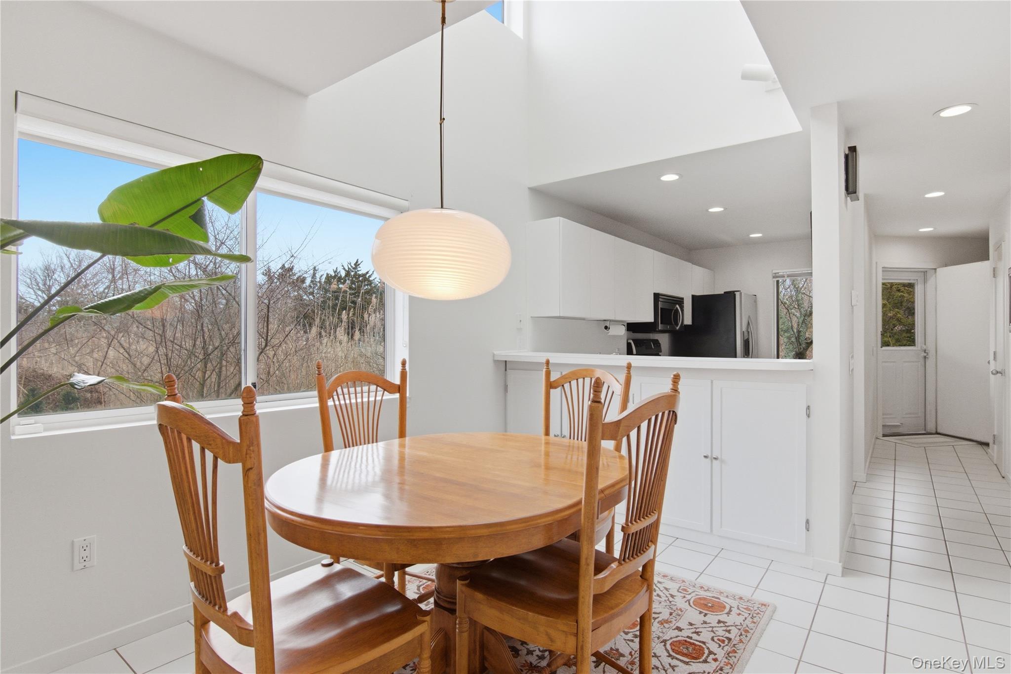 23 Library Avenue, Unit 1 Westhampton Beach, NY 11978 - Photo 8 of 24 Dining area with water view