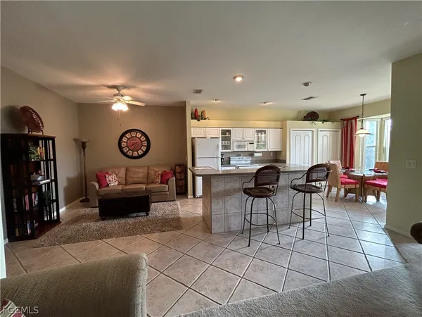 a living room with furniture and a clock