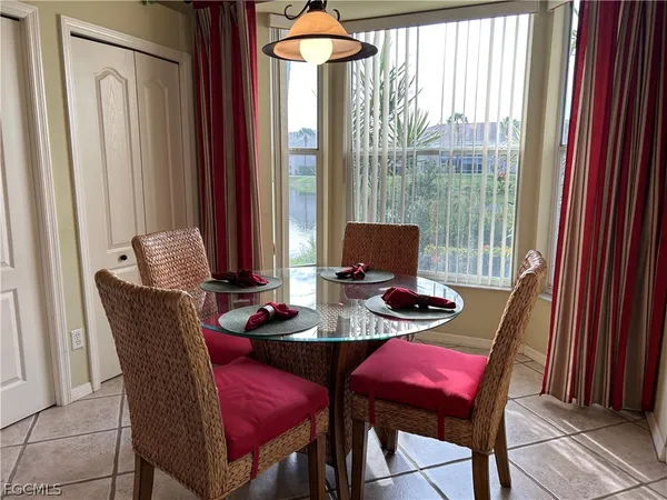 a dining room with furniture and window