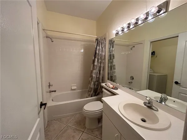 a bathroom with a sink toilet tub and shower