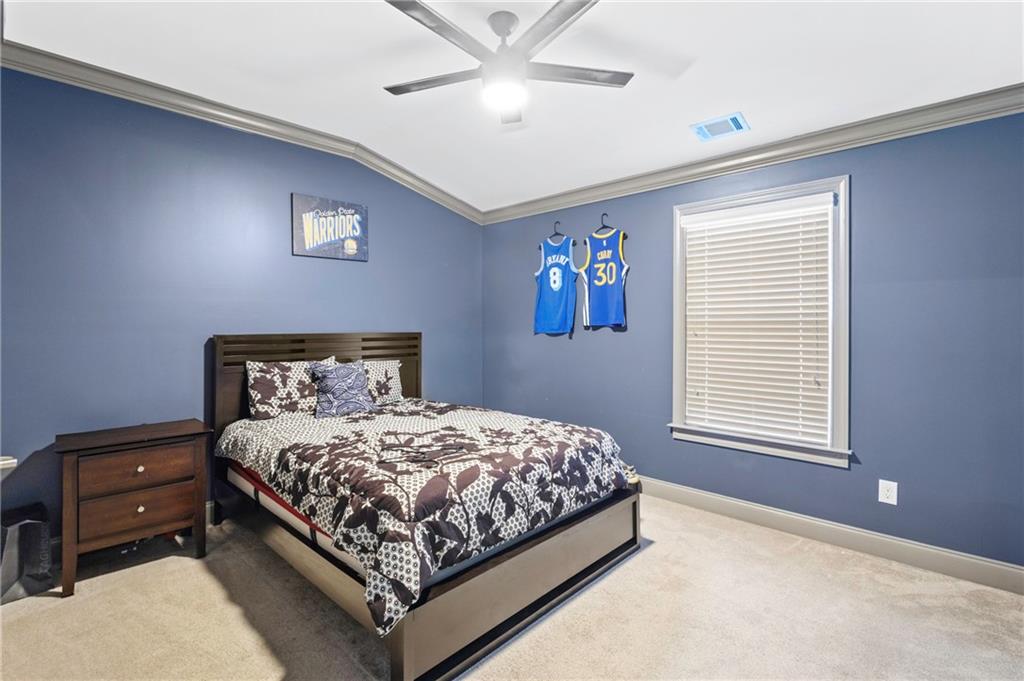 1802 Stephanie Trail Northeast Atlanta, GA 30329 - Photo 11 of 25 a bedroom with a bed and a window