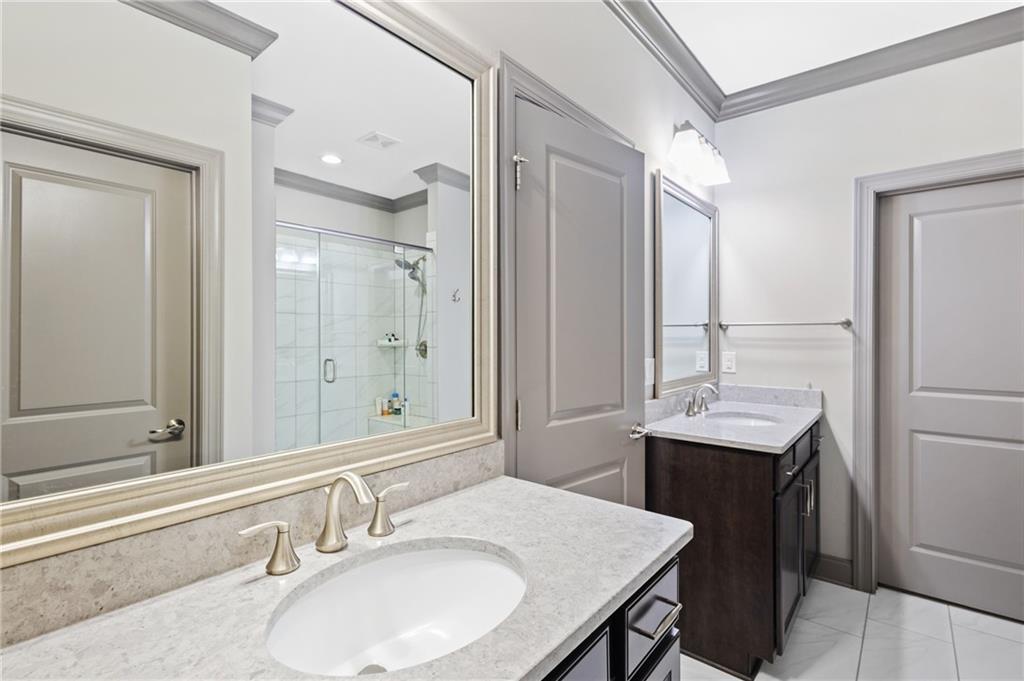 1802 Stephanie Trail Northeast Atlanta, GA 30329 - Photo 16 of 25 a bathroom with a granite countertop sink and a mirror