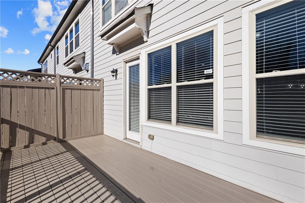 1802 Stephanie Trail Northeast Atlanta, GA 30329 - Photo 17 of 25 a view of a balcony with door and wooden floor